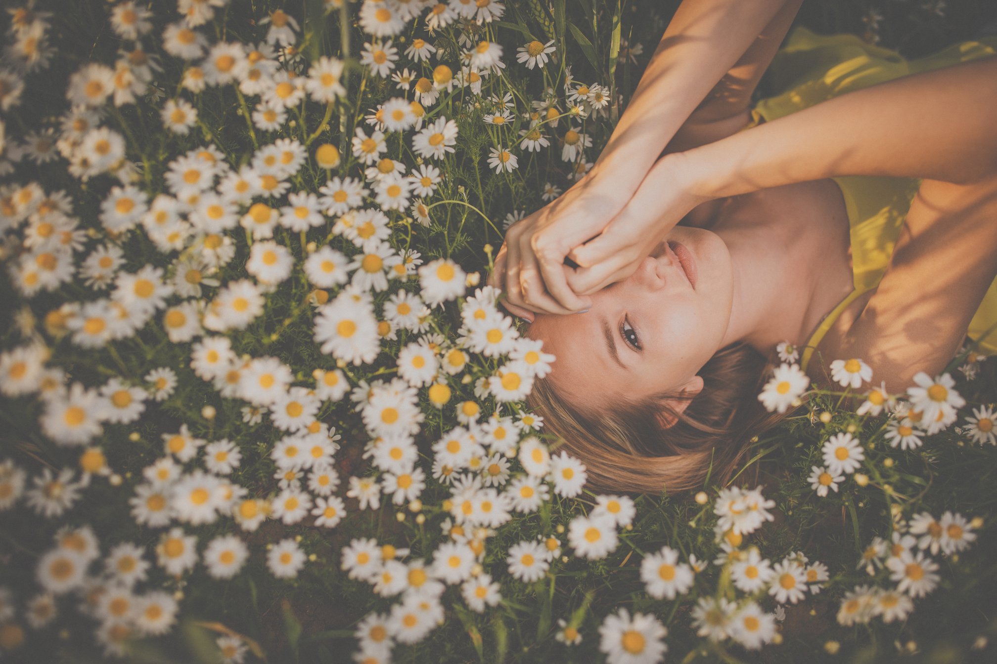 Portrait of Young  Woman with Radiant Clean Skin Lying down amid